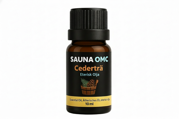 Cederträ eterisk olja med vit bakgrund
